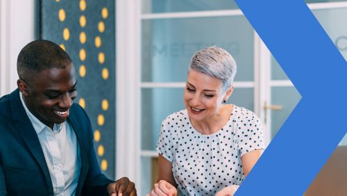 Picture of two business people signing a contract to accompany article on “what to know about loan marketing in a rising rate environment.”