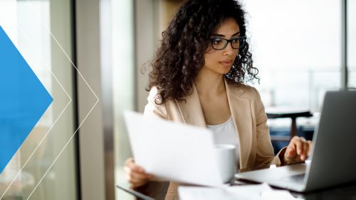 Bank employee working at her desk.