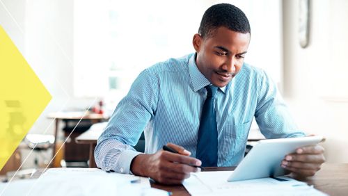 Businessman reviewing tablet