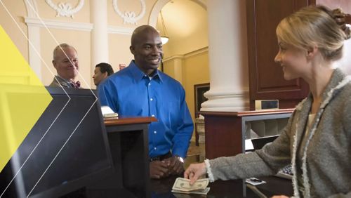 Branch employee helping a customer.