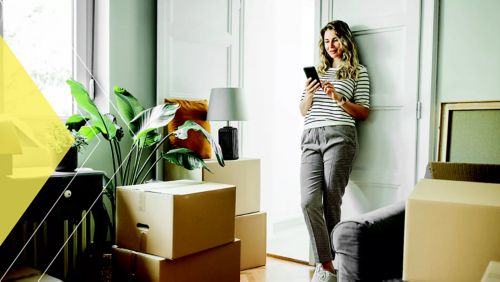 Woman surrounded by moving boxes