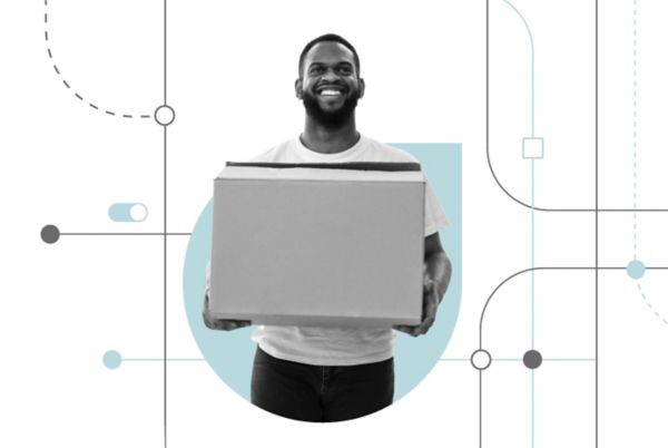 Man carrying a moving box on laptop