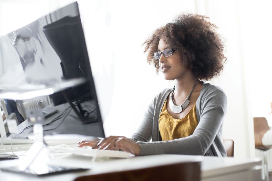 woman looking at computer screen