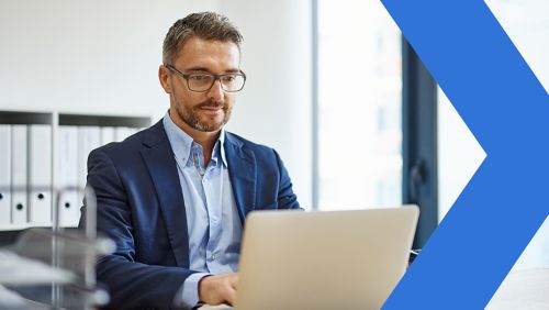 A businessman working on his laptop.