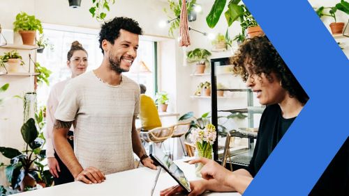 Business owner reviewing employee handbook.