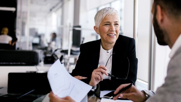 Two people discussing about payroll