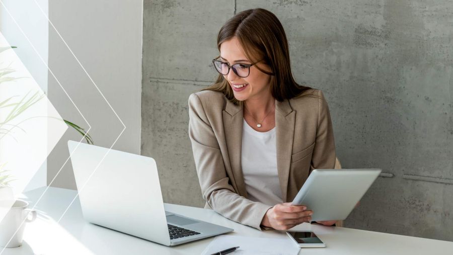 Accounts payable worker processing invoices in office.