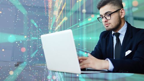 A man using a laptop.