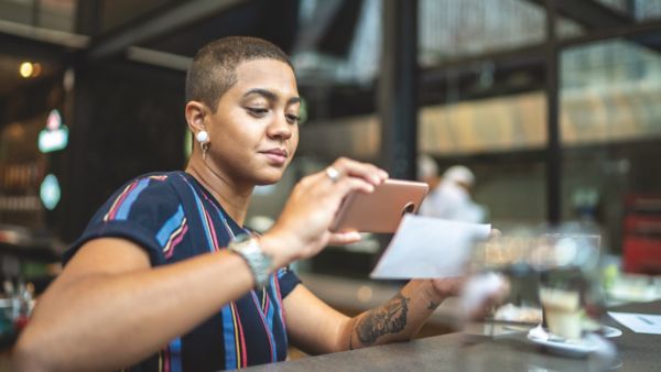 A woman using mobile remote deposit capture