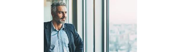 Man looking out a window