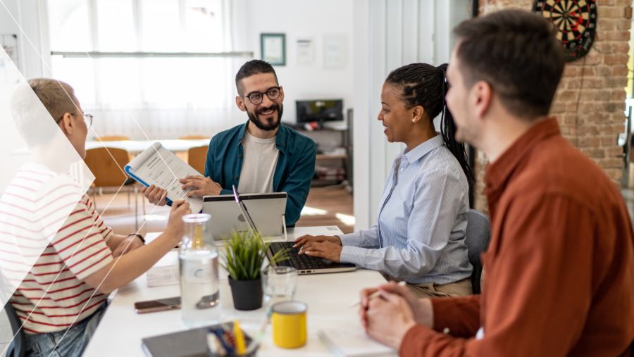 Four coworkers discussing AP automation