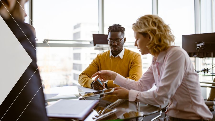 Two coworkers discussing Cash Application