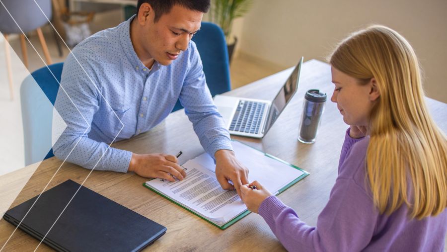 Two people sitting at a desk