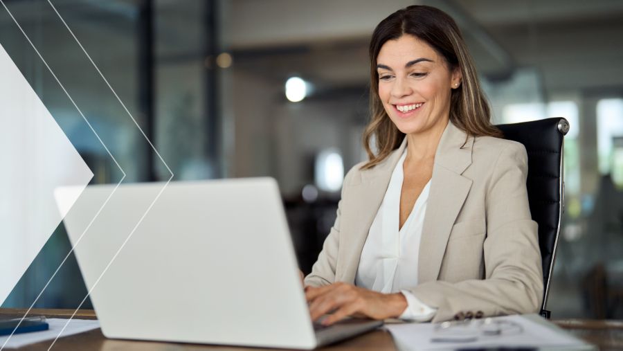 A woman on a laptop in an office