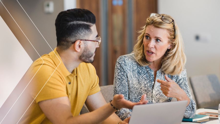 Two people discussing B2B electronic payments