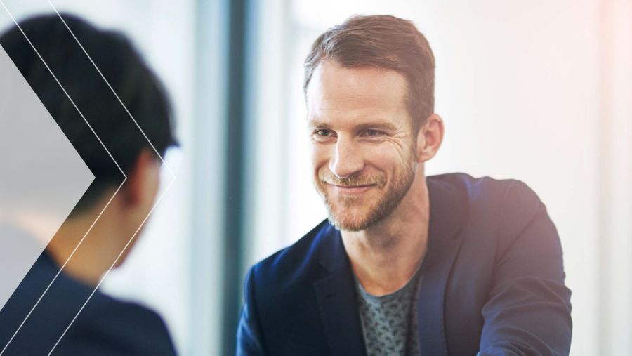 Two people discussing the power of payment networks