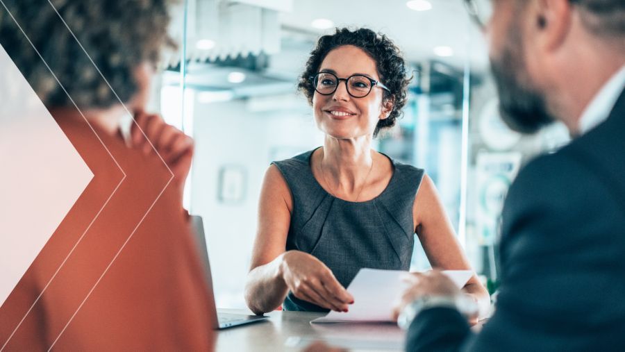 Three coworkers discussing payment initatives